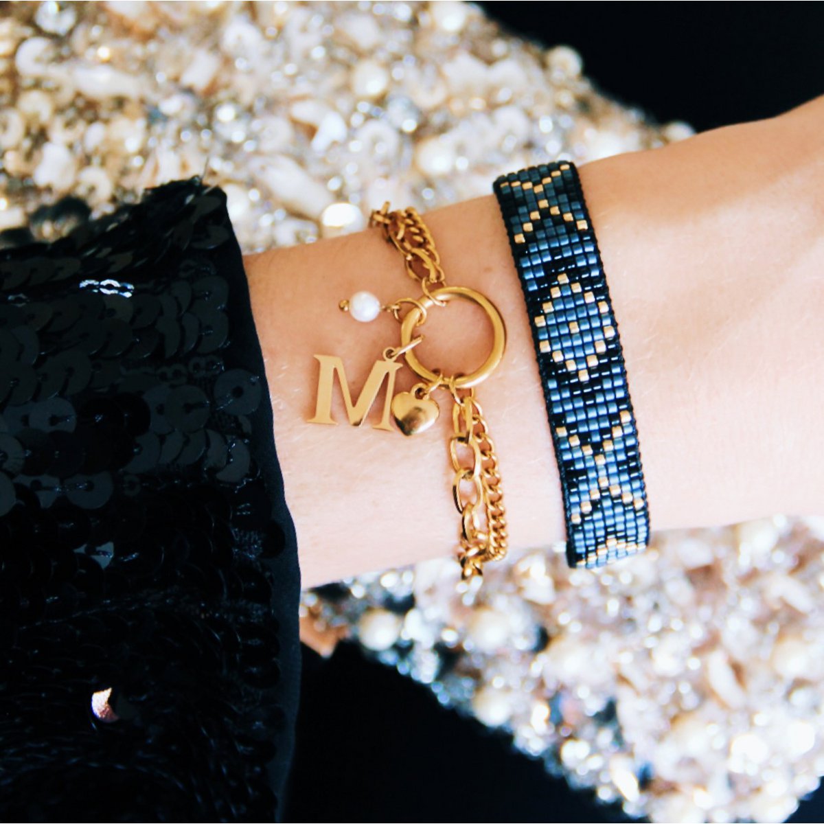 Dubbele schakelarmband met open hart - goud