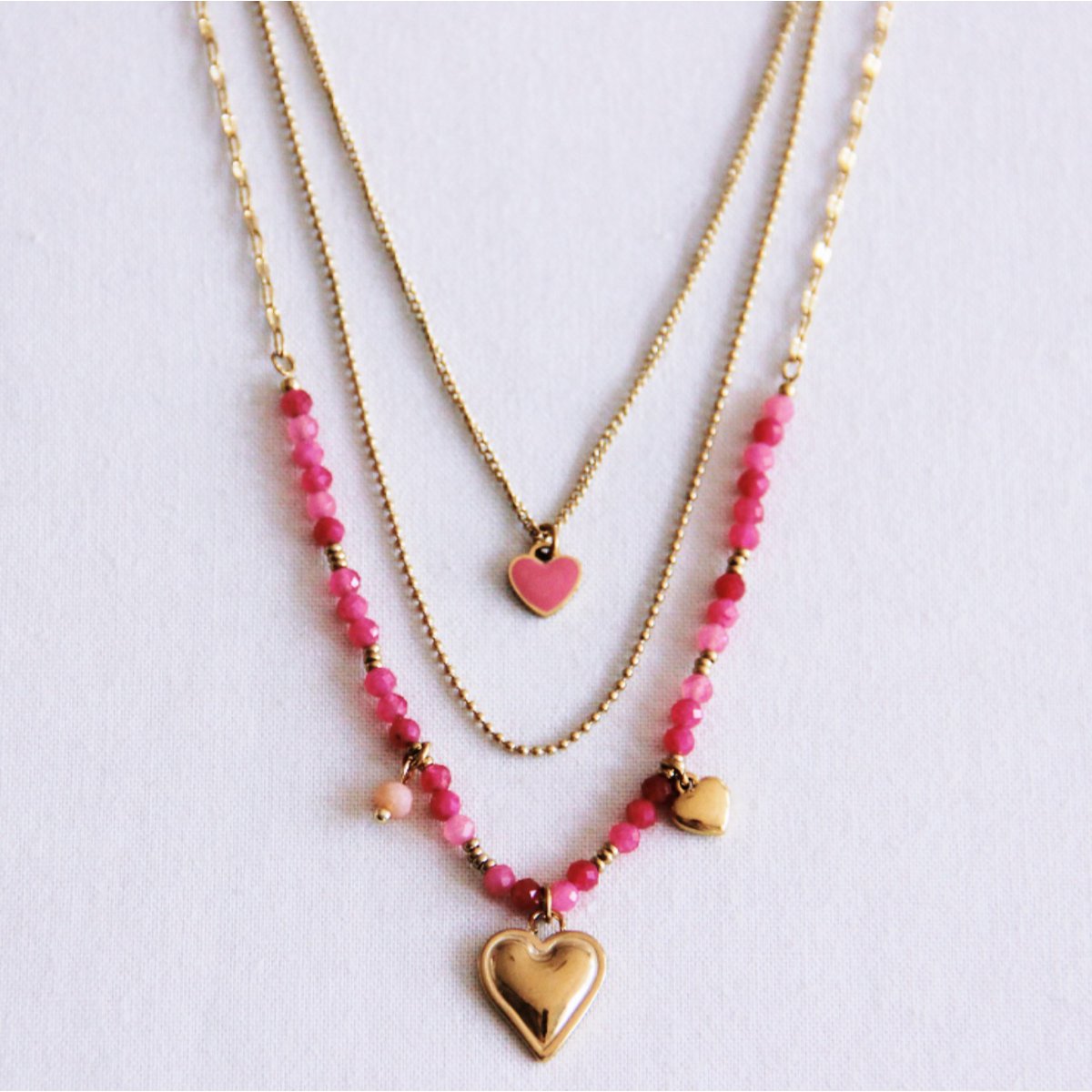 Drievoudige ketting met harten - roze/goud